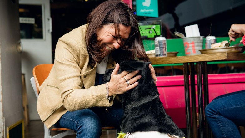 Woman hugs her guide dog