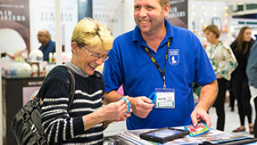 Face to face fundraiser laughing together with a woman