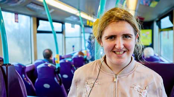 Rebecca travelling on a bus