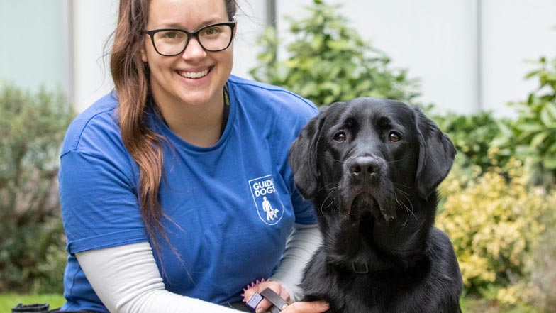 Alfie sitting next to his trainer Beth Alfie sitting next to his trainer Beth