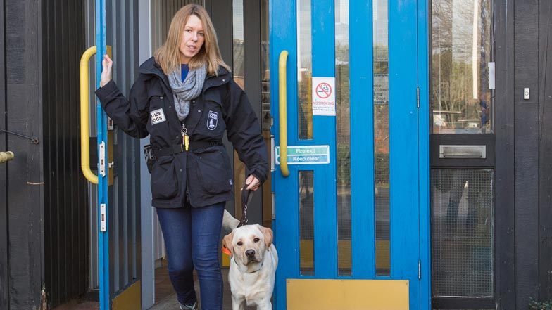 Irvine and Cassi walking out of a Guide Dogs training school Irvine and Cassi walking out of a Guide Dogs training school