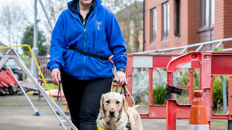 Poppy navigating the obstacle course with Kirsty at a Guide Dogs training school Poppy navigating the obstacle course with Kirsty at a Guide Dogs training school