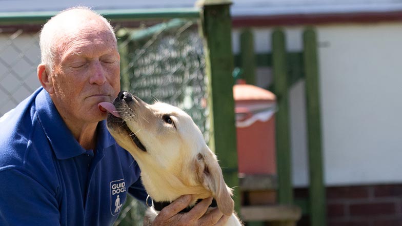 Poppy giving Puppy Walker Keith a kiss Poppy giving Puppy Walker Keith a kiss