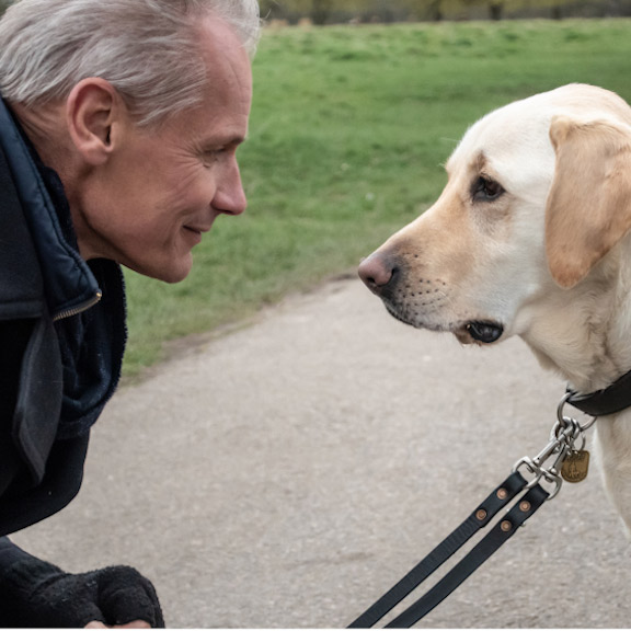 Paul and Bolt looking at each other in profile