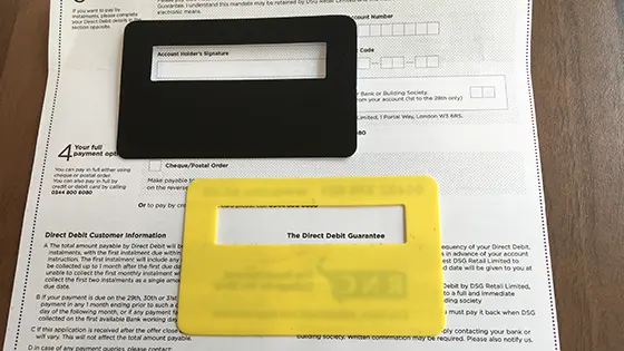 Image shows a document with a black signature guide and a yellow signature guide showing where to add a signature.  
