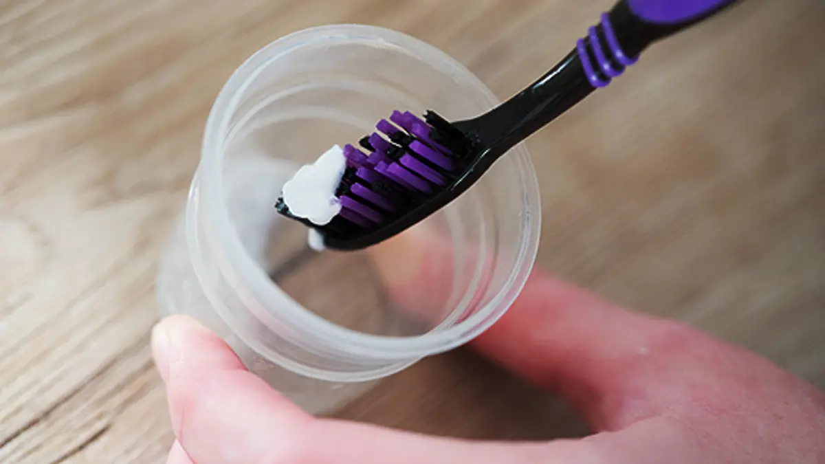 toothpaste-being-scooped-by-a-toothbrush