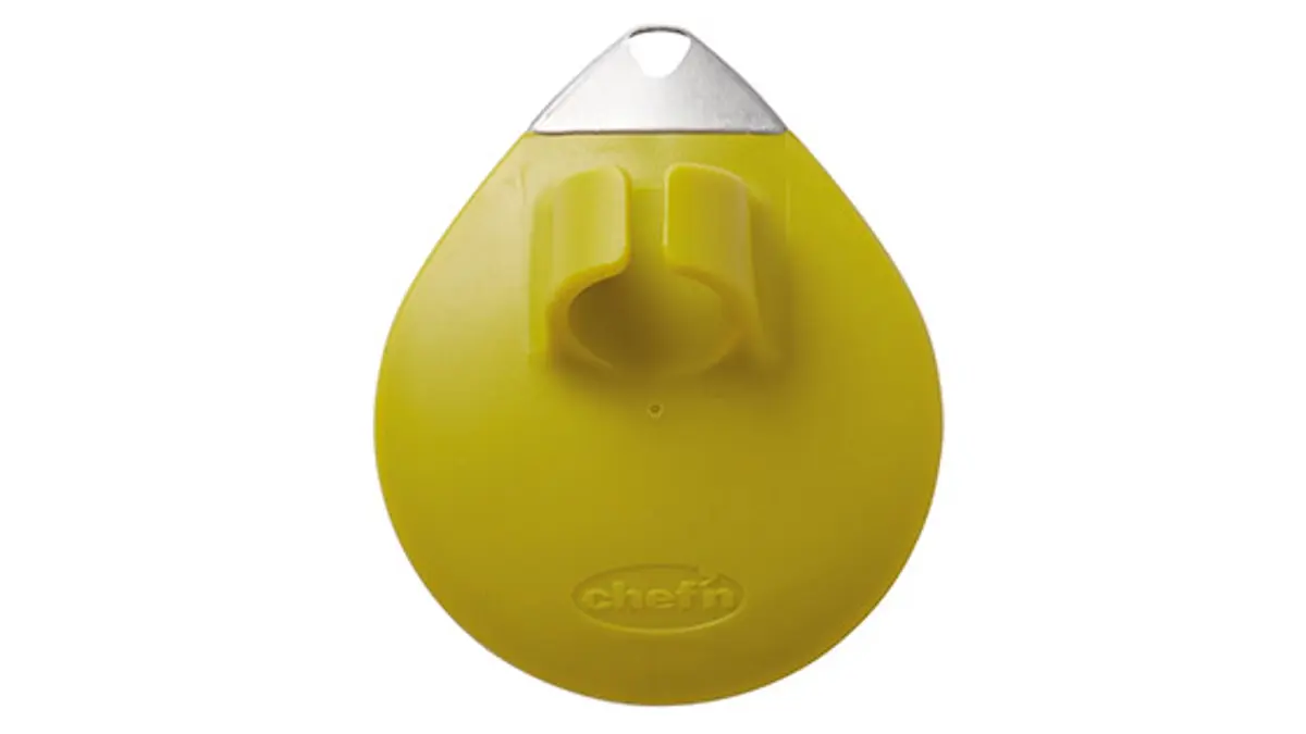 A bright yellow palm peeler with a ring to fit round your finger.