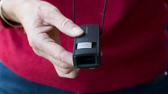 Front view of someone holding a monocular