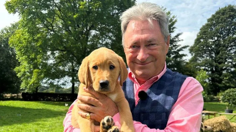 Alan Titchmarsh holding Puppy Titch