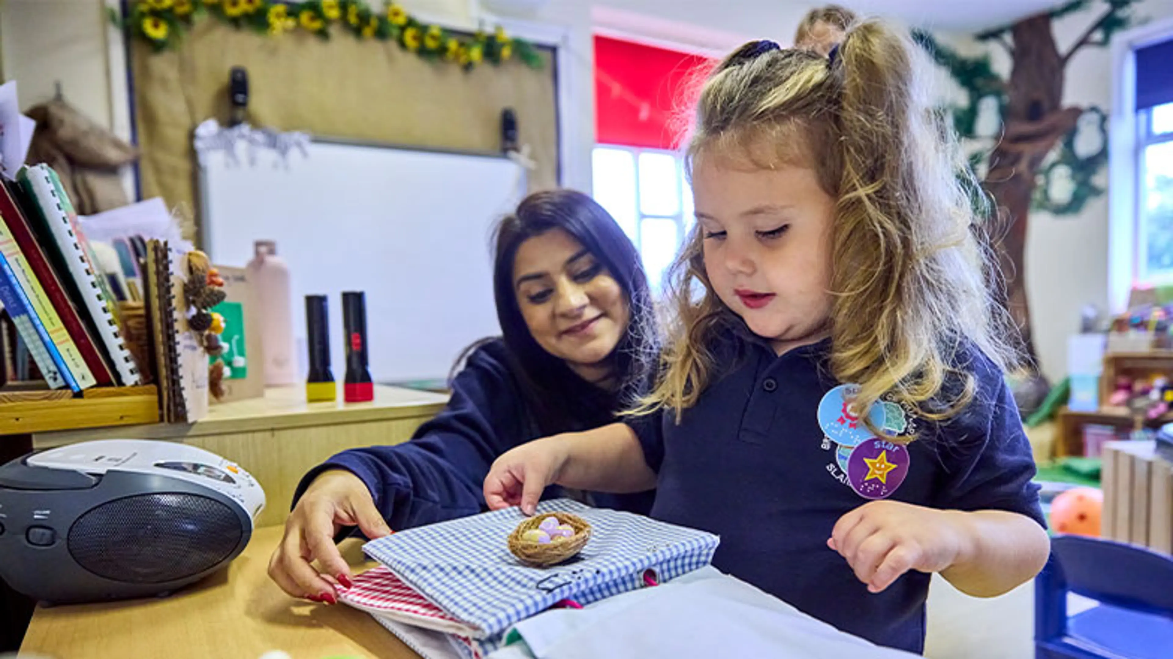 Mabel at school with her habilitation specialist helping her.