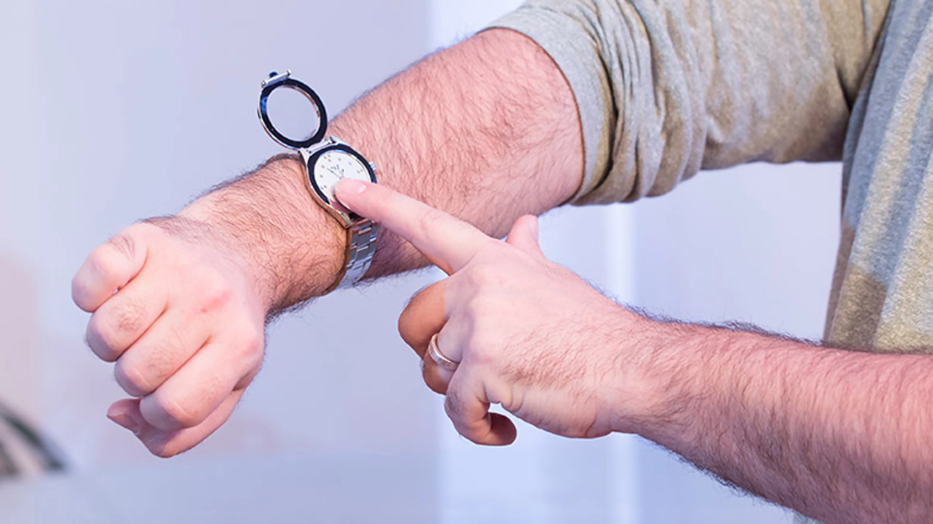 Picture of a man's arm wearing a Braille watch