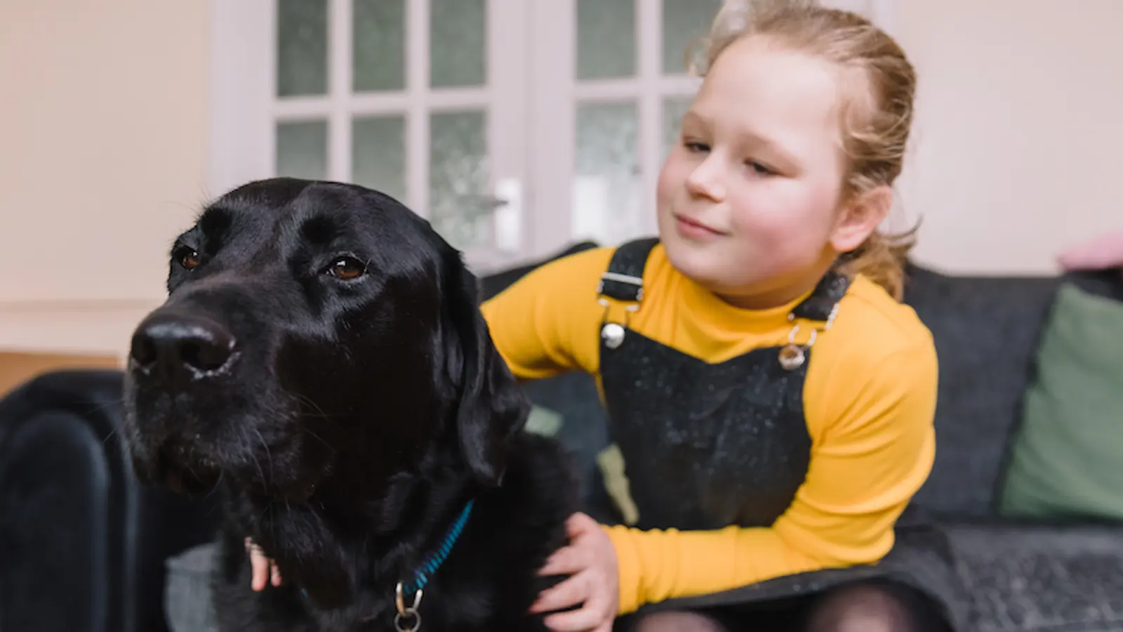 Nine year old Oashia with her buddy dog Garston