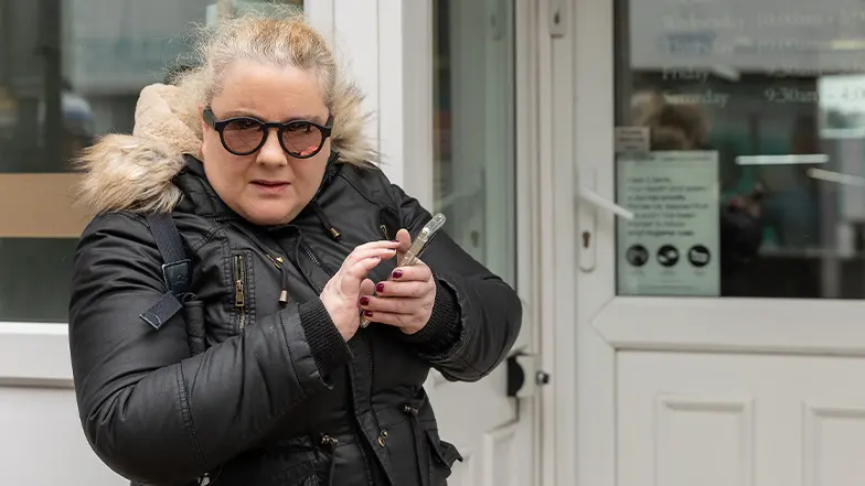 Marie uses her phone for navigation