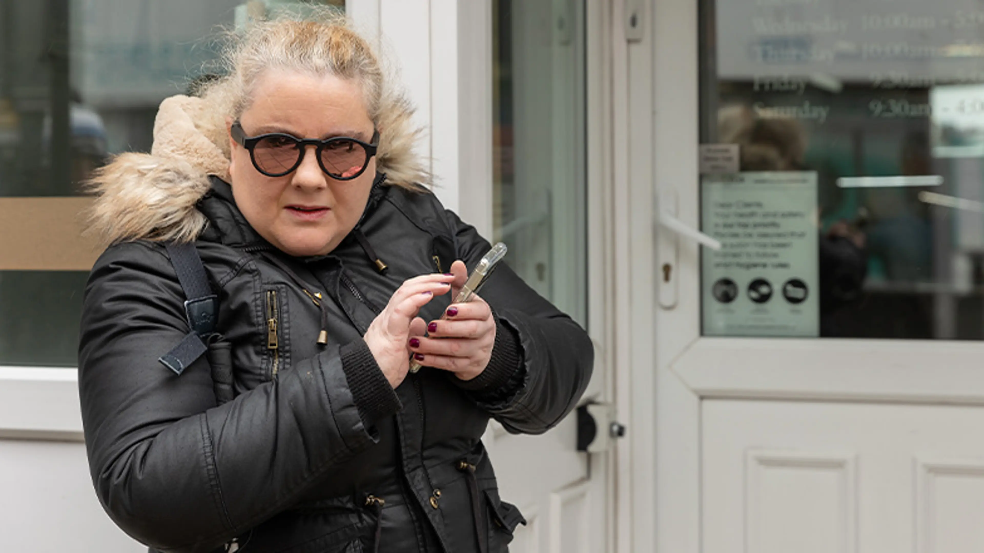 Marie uses her phone for navigation