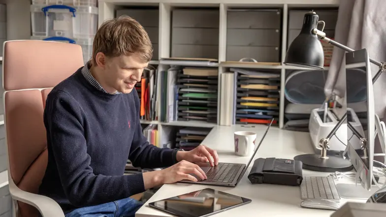 Callum using a screen reader on his laptop