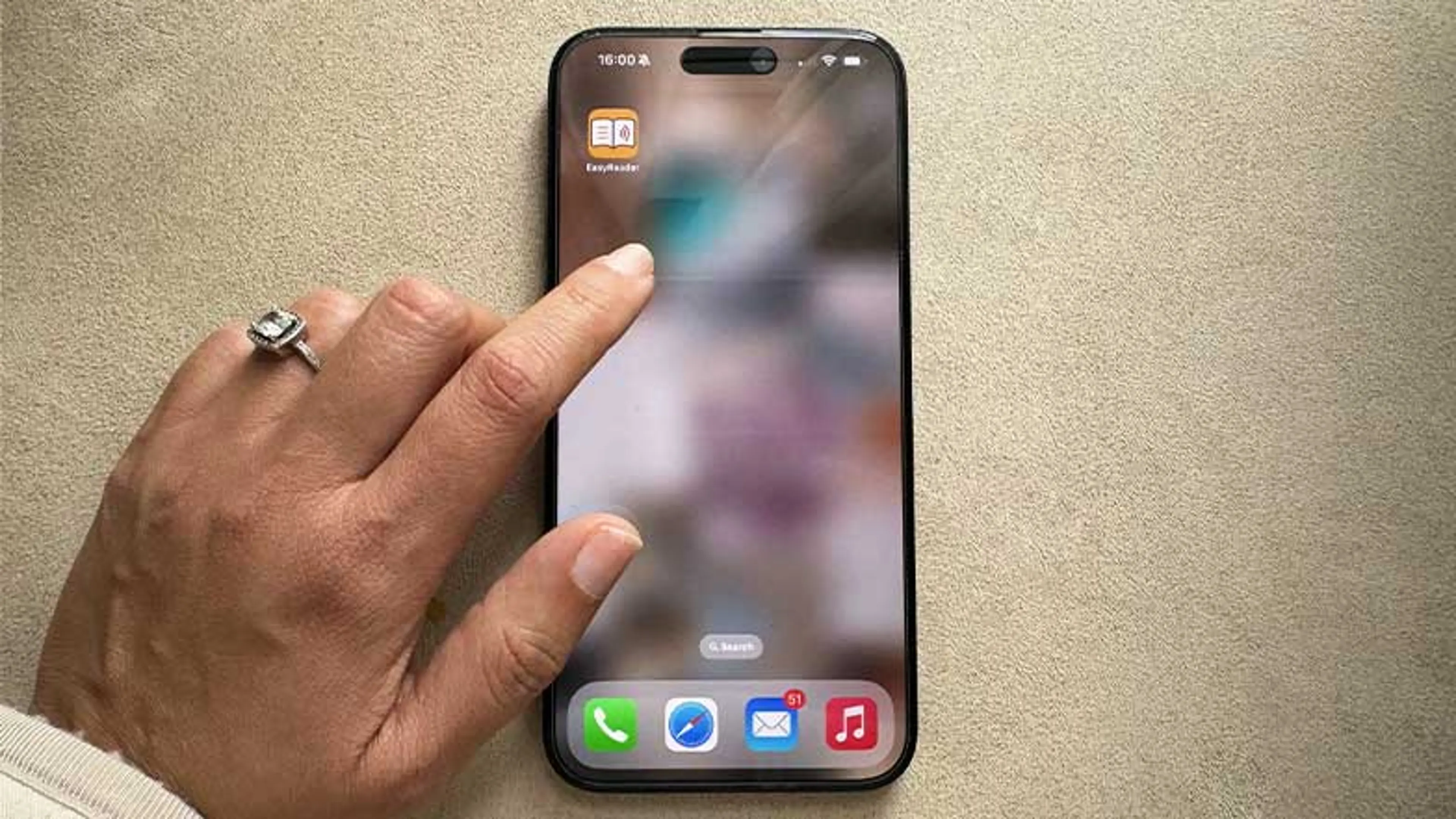 A person opening the Dolphin easy reader application using an iPhone