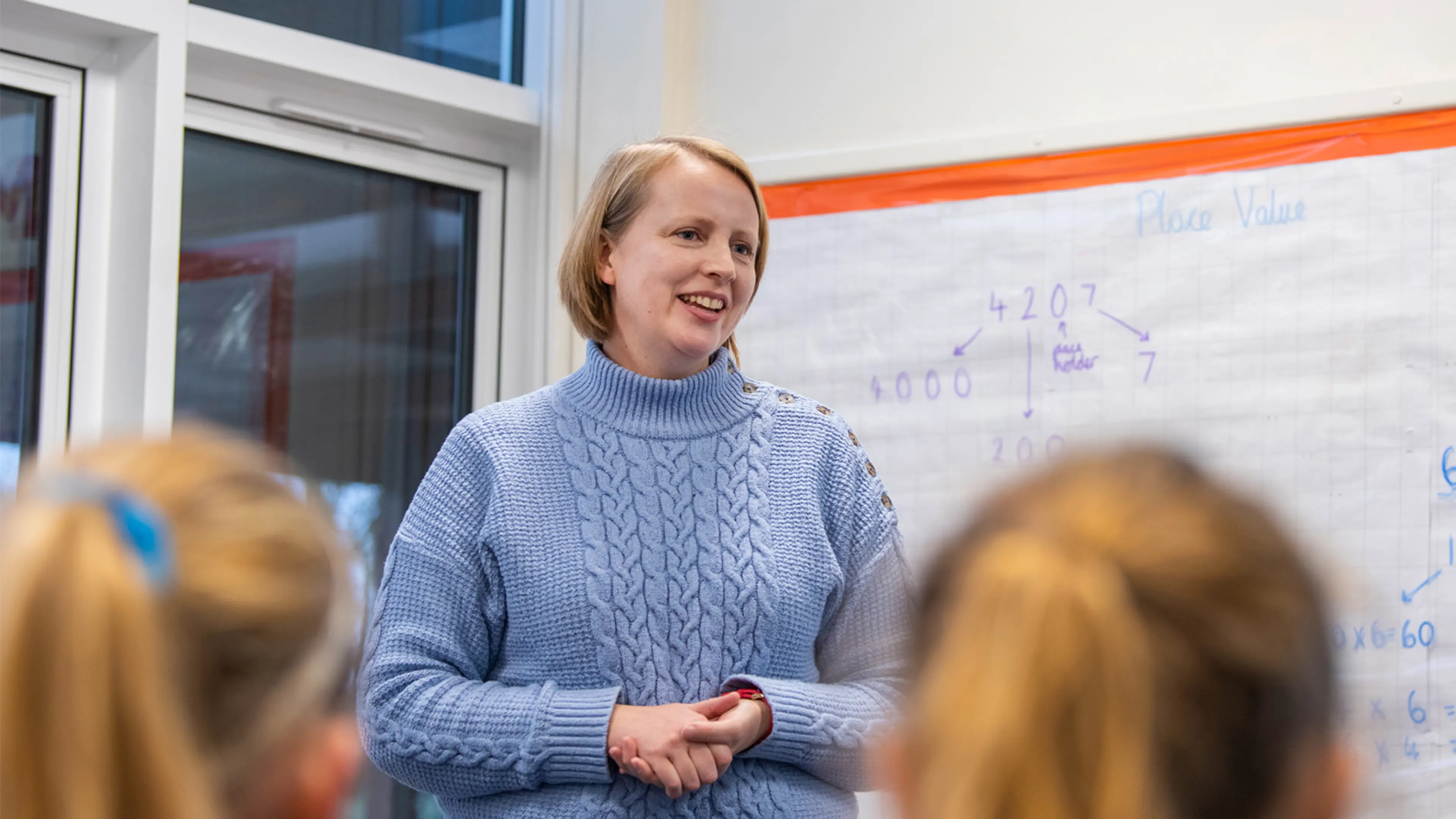 Primary school children are taught about Guide Dogs through lessons and activities with a volunteer.