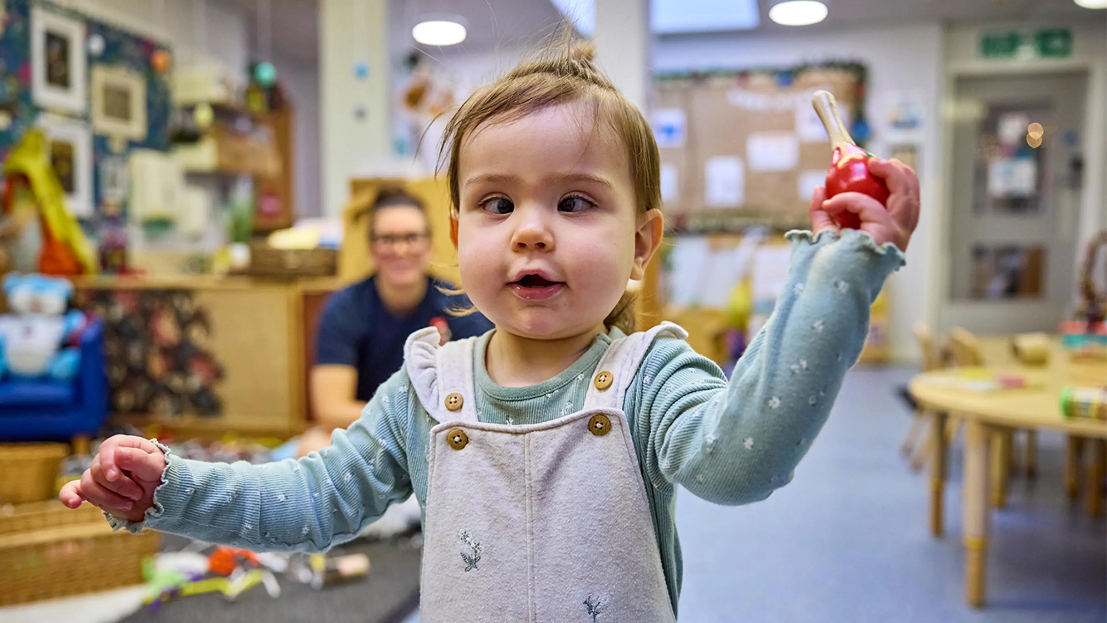 Baby Indiana playing with a rattle at a my time to play session. 