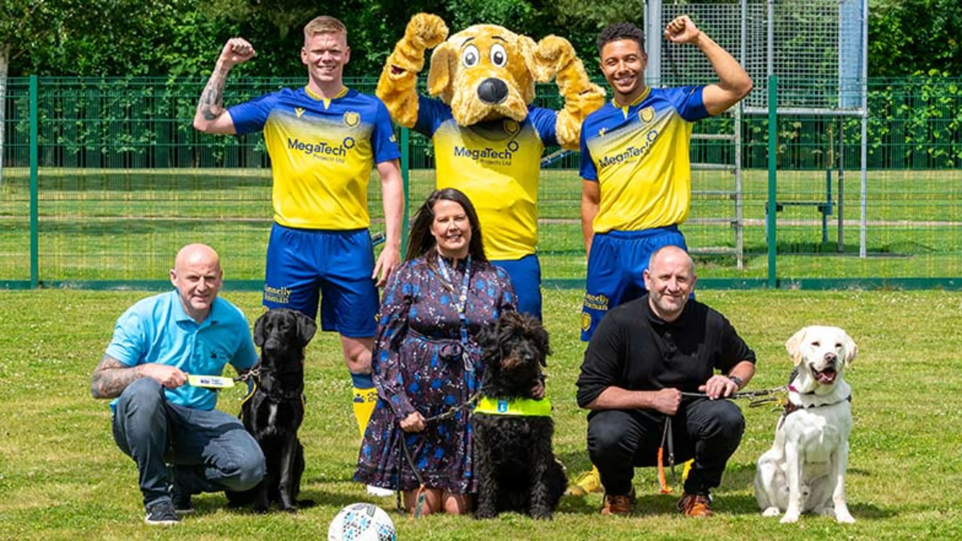 Arbroath FC with Guide Dogs mascot and guide dogs in training on football pitch