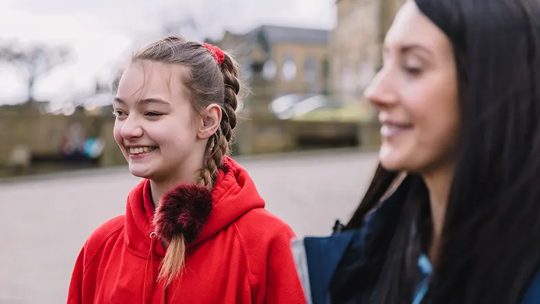 Mia smiling with Guide Dogs habilitation specialist